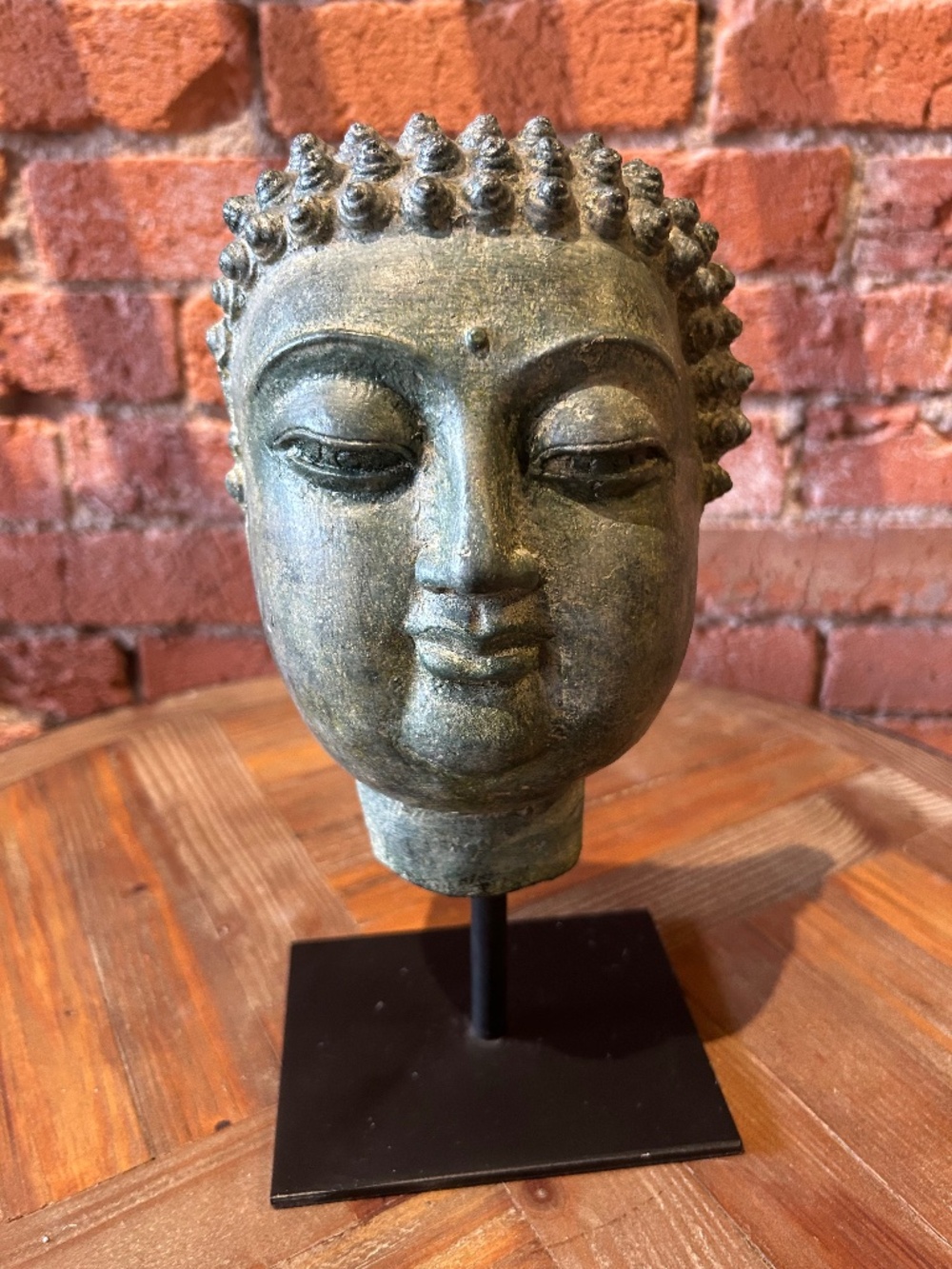 Buddha on stand by Cyan
